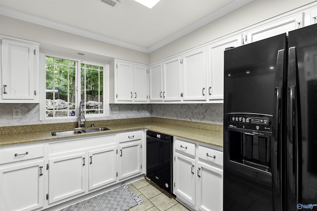 kitchen with black appliances, crown molding, white cabinets, and a sink