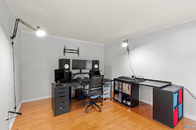 office space featuring ornamental molding and wood finished floors