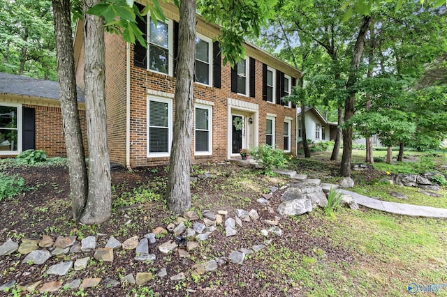 view of home's exterior with brick siding