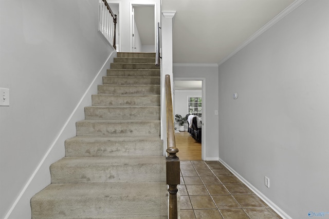 stairway featuring ornamental molding, tile patterned flooring, and baseboards