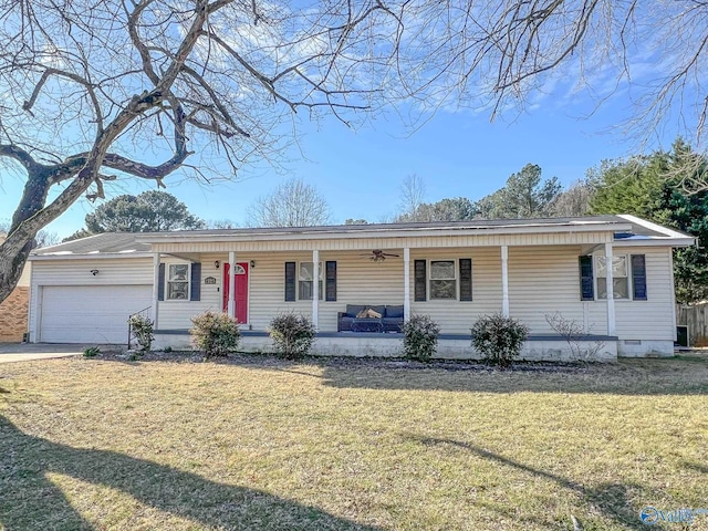 ranch-style house with covered porch, an attached garage, a front yard, crawl space, and driveway