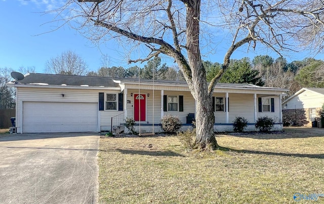 ranch-style house featuring a front yard, concrete driveway, and an attached garage