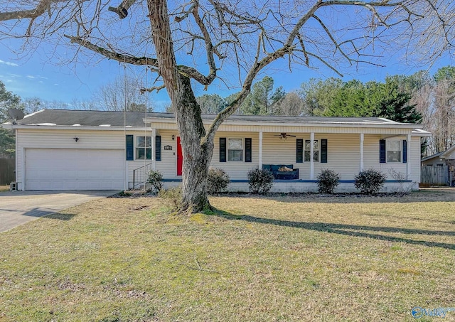 single story home with a garage, driveway, and a front lawn