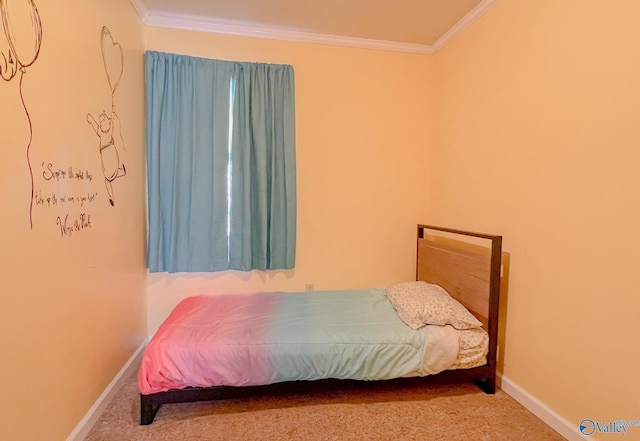 carpeted bedroom with ornamental molding and baseboards