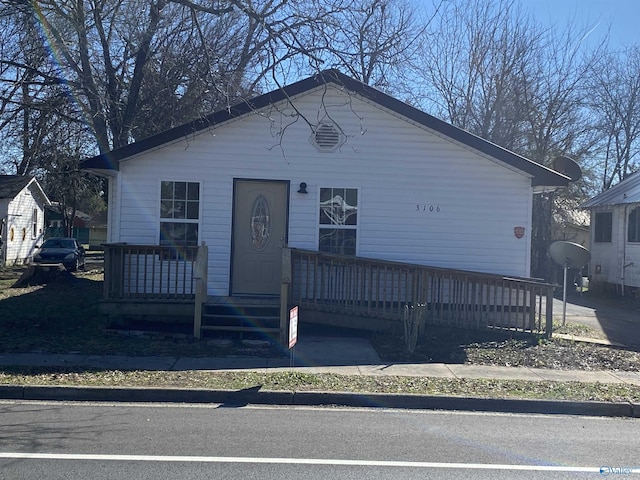 view of front facade with a wooden deck