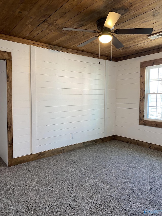 carpeted empty room with wooden ceiling and ceiling fan