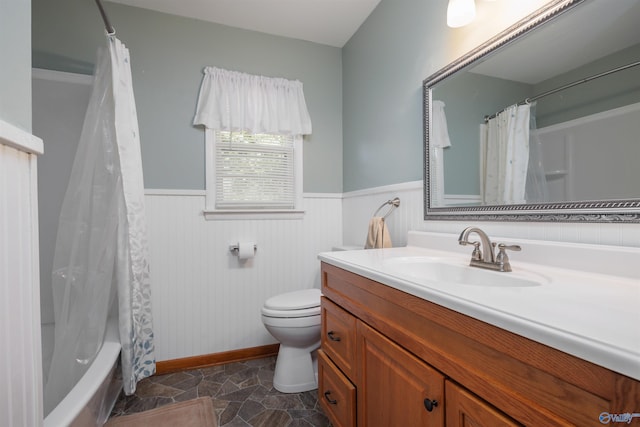 full bathroom with vanity, toilet, and shower / bath combo with shower curtain