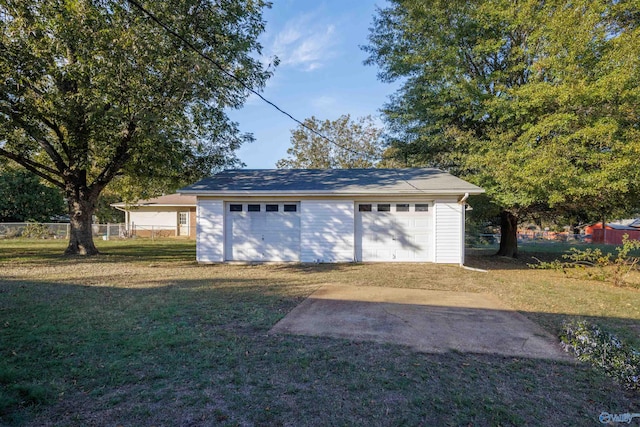 garage featuring a yard