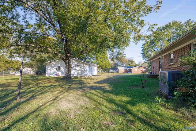 view of yard with central AC unit