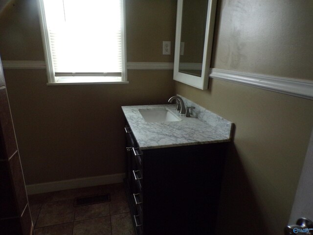 bathroom with vanity and tile patterned floors