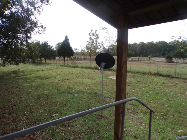 view of yard with a rural view