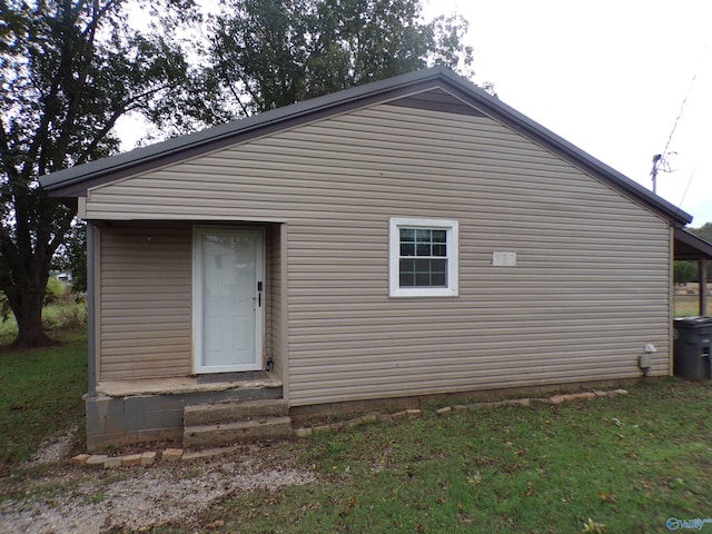 rear view of property with a lawn