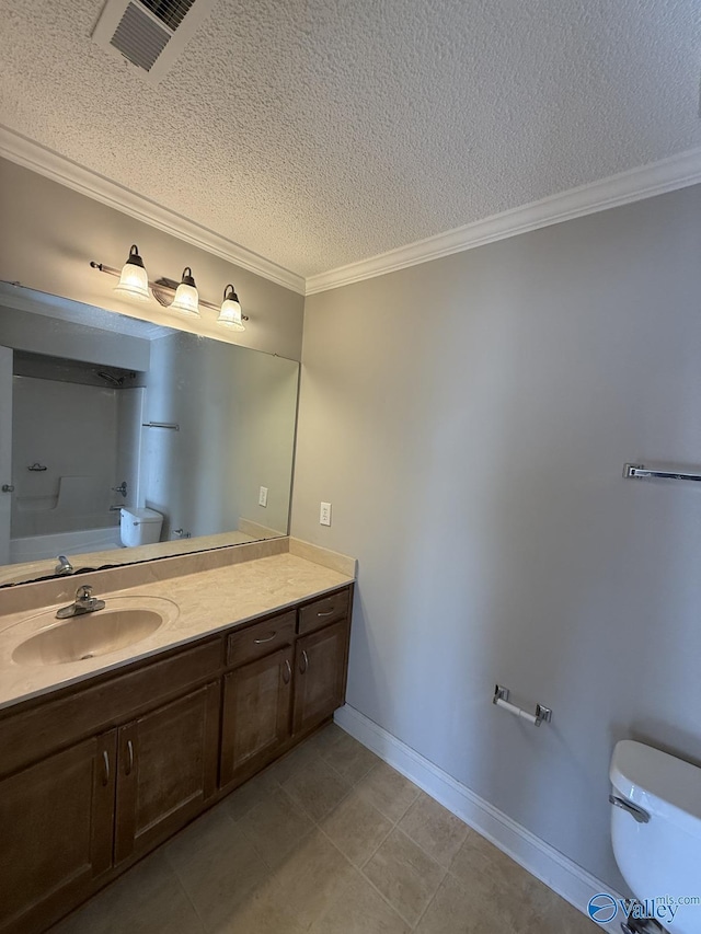 bathroom featuring vanity, baseboards, ornamental molding, a textured ceiling, and toilet