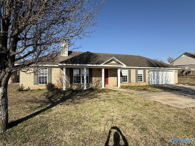 single story home featuring a front yard, an attached garage, brick siding, and driveway