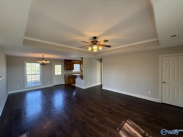 unfurnished living room featuring dark wood finished floors, a raised ceiling, ceiling fan with notable chandelier, and a textured ceiling