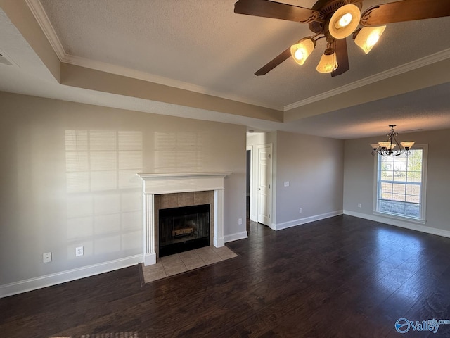 unfurnished living room featuring baseboards, a textured ceiling, wood finished floors, and a tile fireplace