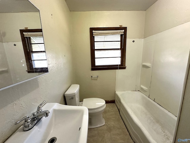 full bathroom featuring bathtub / shower combination, sink, and toilet