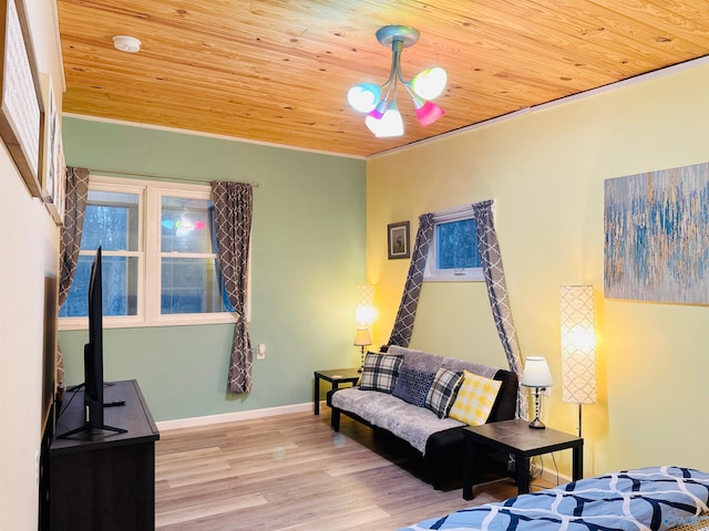 living room featuring wood ceiling, baseboards, and wood finished floors