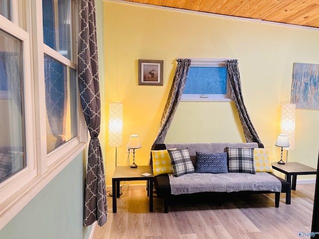 sitting room featuring wooden ceiling and wood finished floors