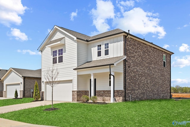 view of front of home featuring a front lawn and a garage