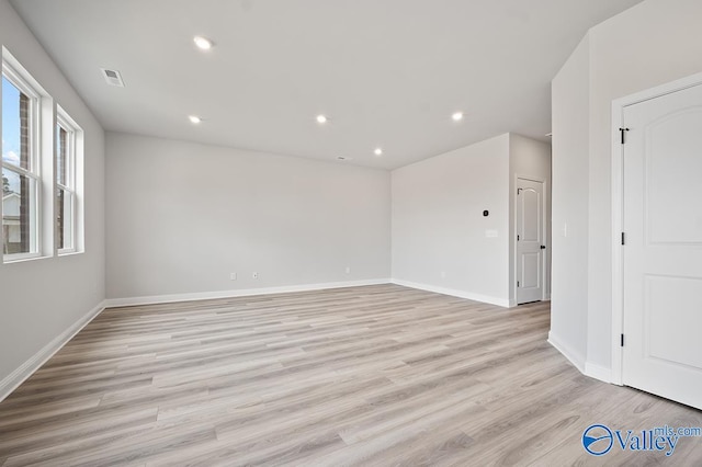 spare room with light wood-type flooring