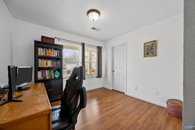 office space featuring hardwood / wood-style floors