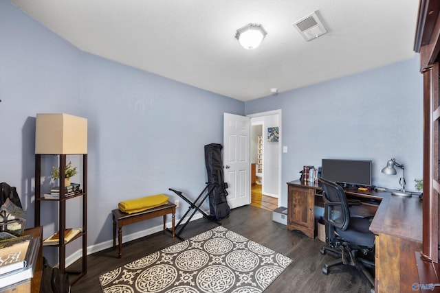 office with dark hardwood / wood-style flooring