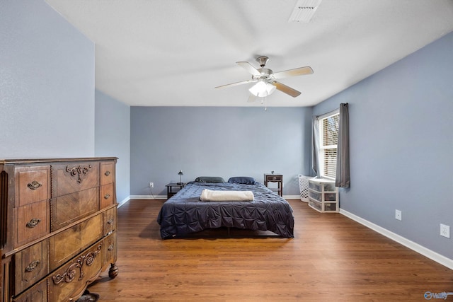 bedroom featuring ceiling fan and hardwood / wood-style floors