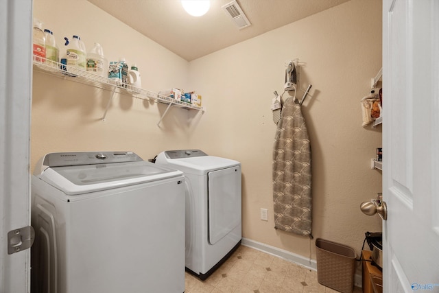 washroom with washer and dryer