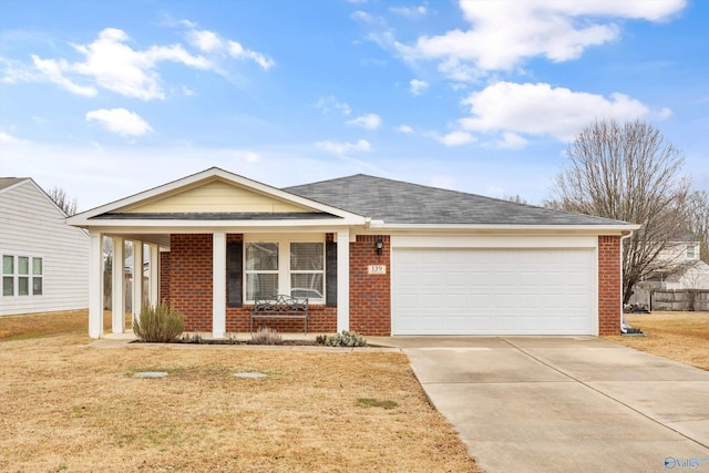 view of front of house with a garage, a front yard, and covered porch