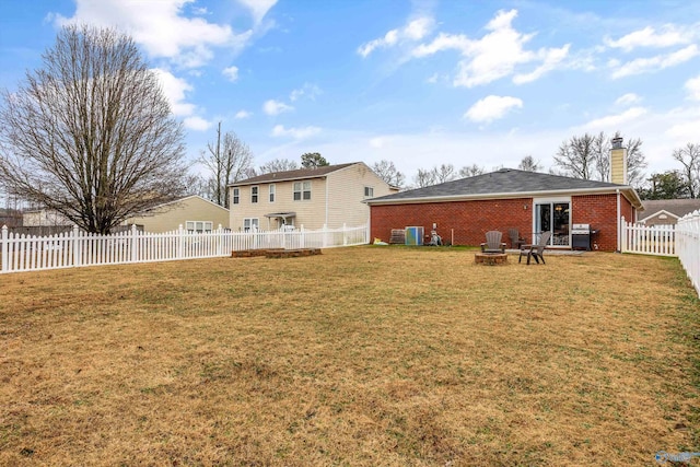 view of yard with a fire pit