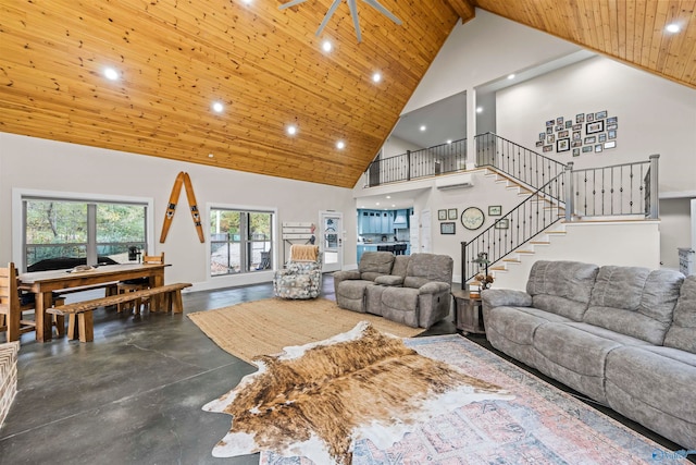 living room featuring wood ceiling, a wall mounted air conditioner, high vaulted ceiling, and concrete floors