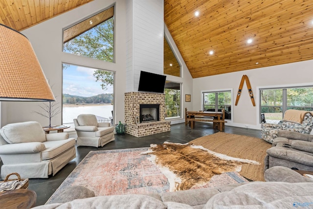 living room with wood ceiling, high vaulted ceiling, and a brick fireplace