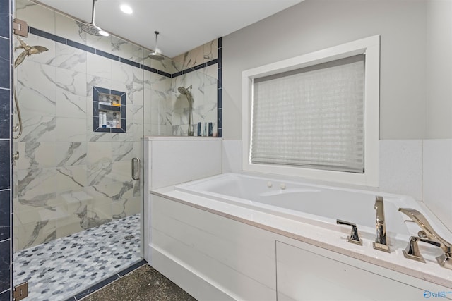 bathroom with separate shower and tub