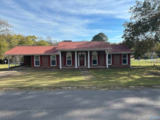 ranch-style house with a front lawn and a carport