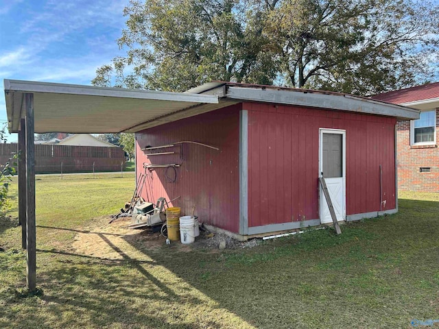 view of outdoor structure featuring a lawn