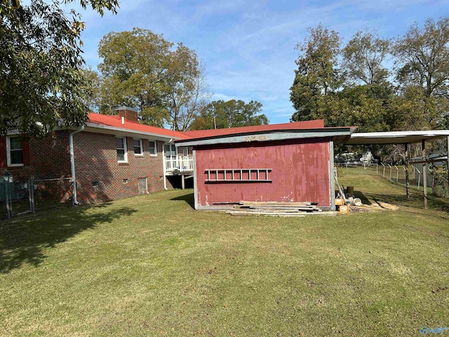 view of outbuilding with a yard