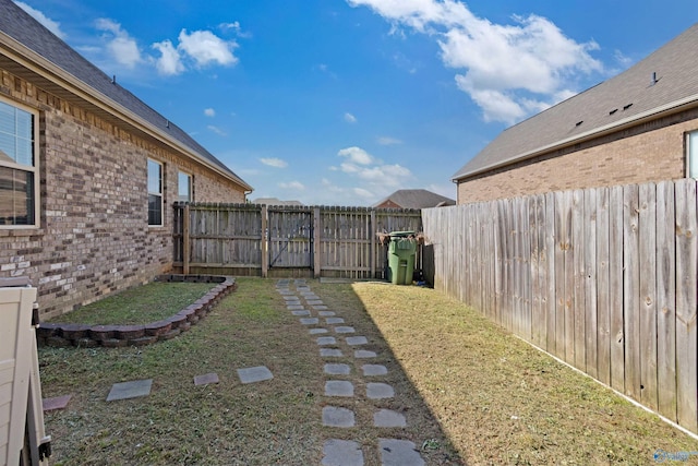 view of yard with a fenced backyard