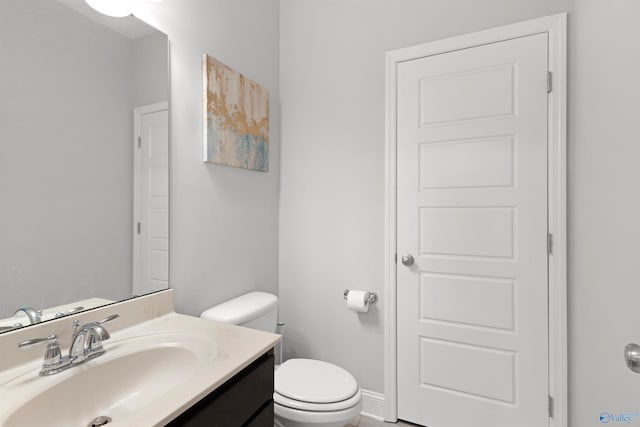half bath with toilet and vanity
