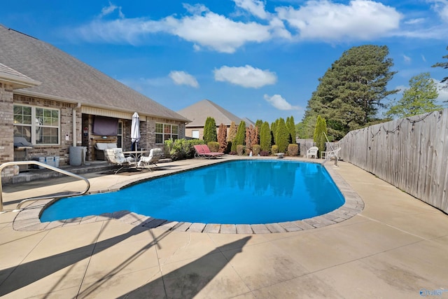 view of pool featuring a fenced in pool, a patio, and fence