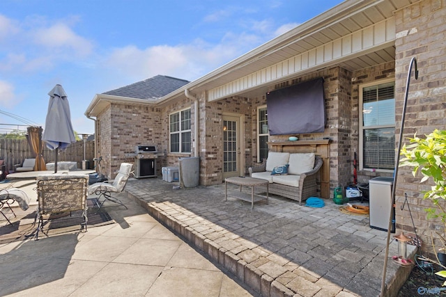 view of patio / terrace featuring area for grilling, outdoor dining space, outdoor lounge area, and fence
