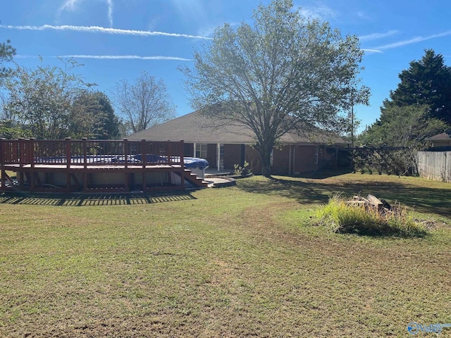 view of yard featuring a wooden deck