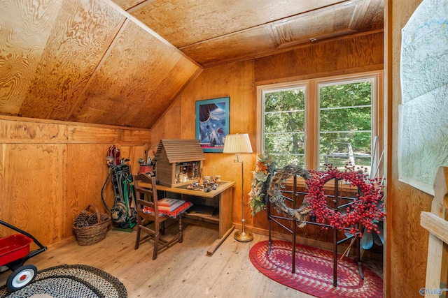 home office featuring vaulted ceiling, wooden ceiling, wooden walls, and hardwood / wood-style flooring