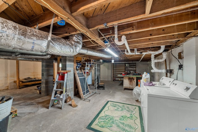 basement featuring washer and clothes dryer