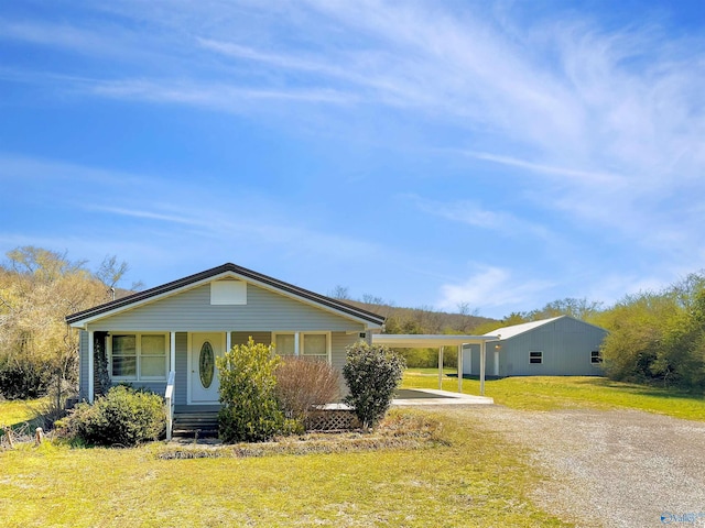15766 Alabama Highway 79, Scottsboro, AL 35768 - view of front facade with covered porch, a front yard, driveway, and a carport