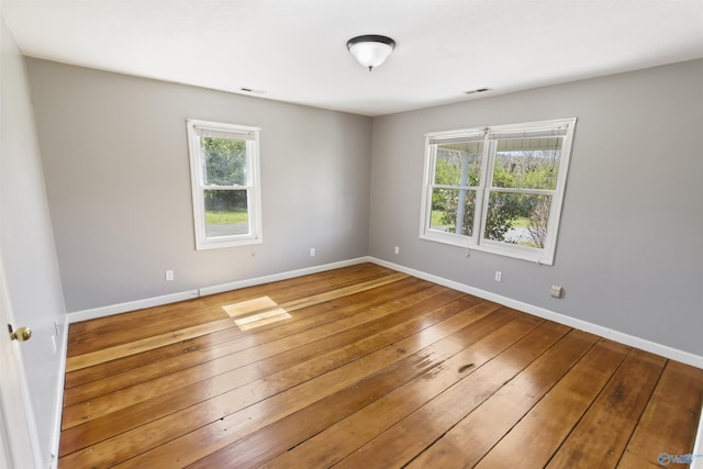 15766 Alabama Highway 79, Scottsboro, AL 35768 - empty room with hardwood / wood-style floors and baseboards