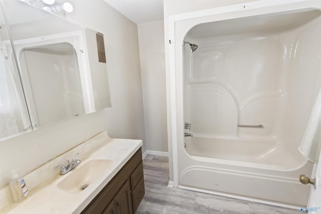15766 Alabama Highway 79, Scottsboro, AL 35768 - full bath with shower / washtub combination, baseboards, vanity, and wood finished floors
