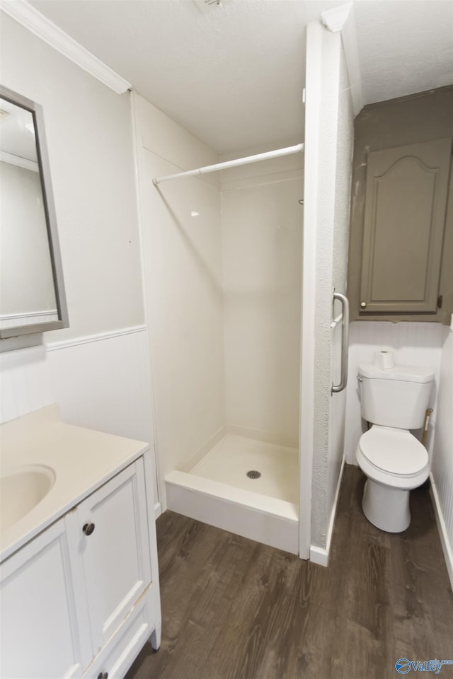 15766 Alabama Highway 79, Scottsboro, AL 35768 - full bathroom with wood finished floors, a shower stall, vanity, crown molding, and toilet