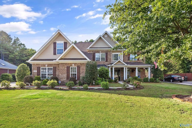 craftsman-style home featuring a front lawn