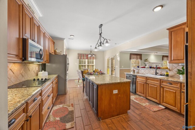 kitchen with a center island, stainless steel appliances, dark hardwood / wood-style flooring, and tasteful backsplash